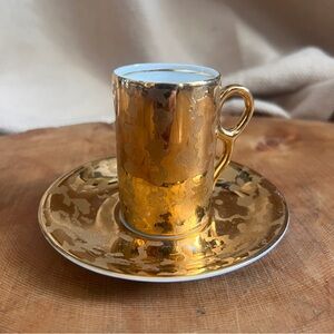 Vintage tiny golden cup and saucer‎